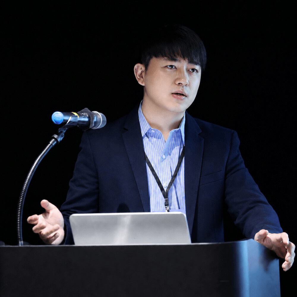 YongKyung Oh speaking at a lectern